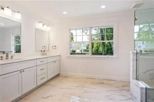 Custom white shaker bathroom designed in NYC by Kitchens by Frankie in Westchester