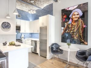 Custom white slab door NYC kitchen designed by Kitchens by Frankie in Westchester